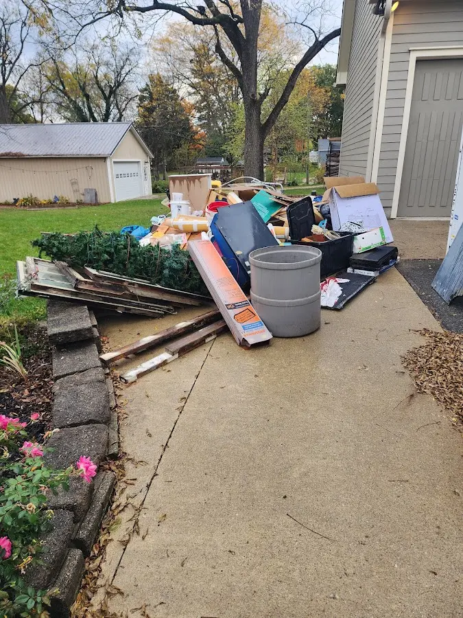 Dumpster being loaded with debris for 3 Yard Dumpster Rental in Clifton Forge
